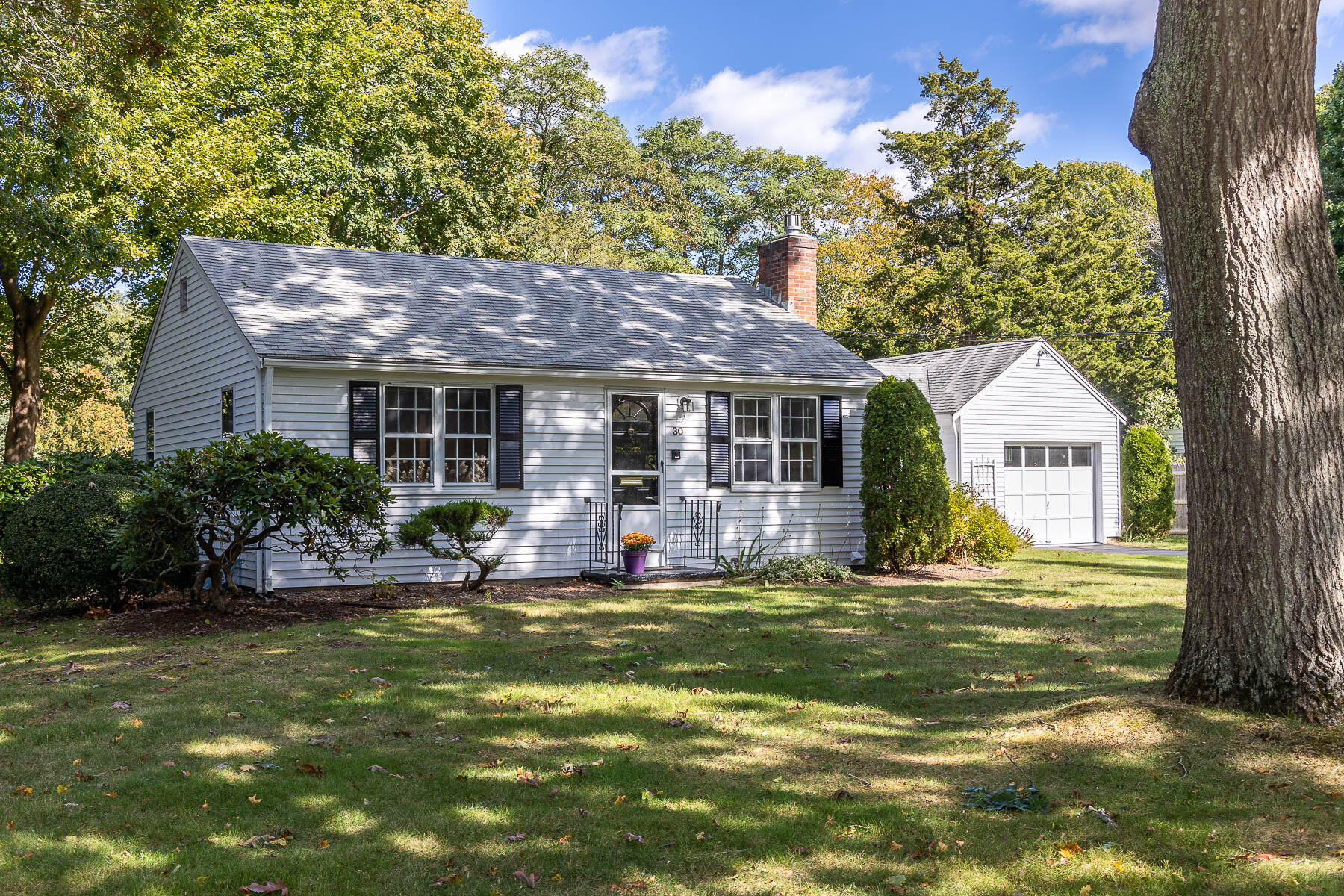30 Davis Road Falmouth, MA 02540 - Photo 4 of 38 a house view with a sitting space and garden