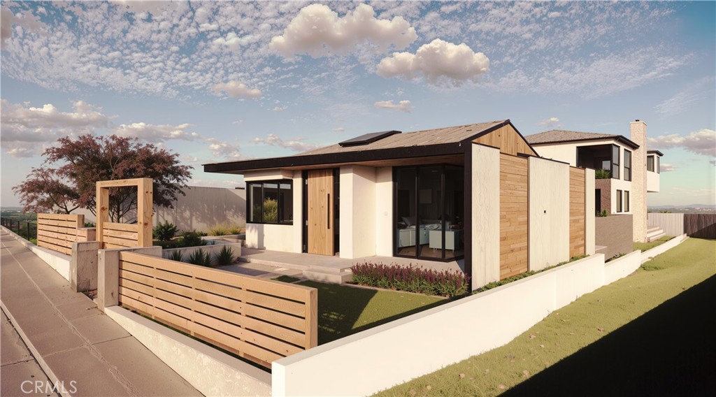 a front view of a house with glass doors