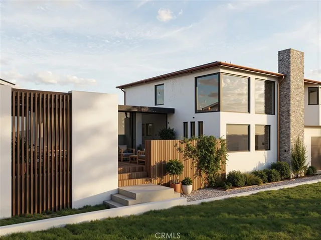 a view of a house with backyard and a tree