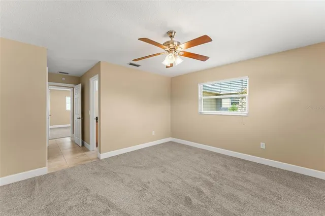 a view of an empty room and window