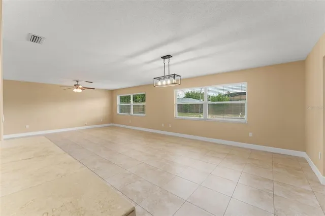 a kitchen with kitchen island a sink stainless steel appliances and cabinets