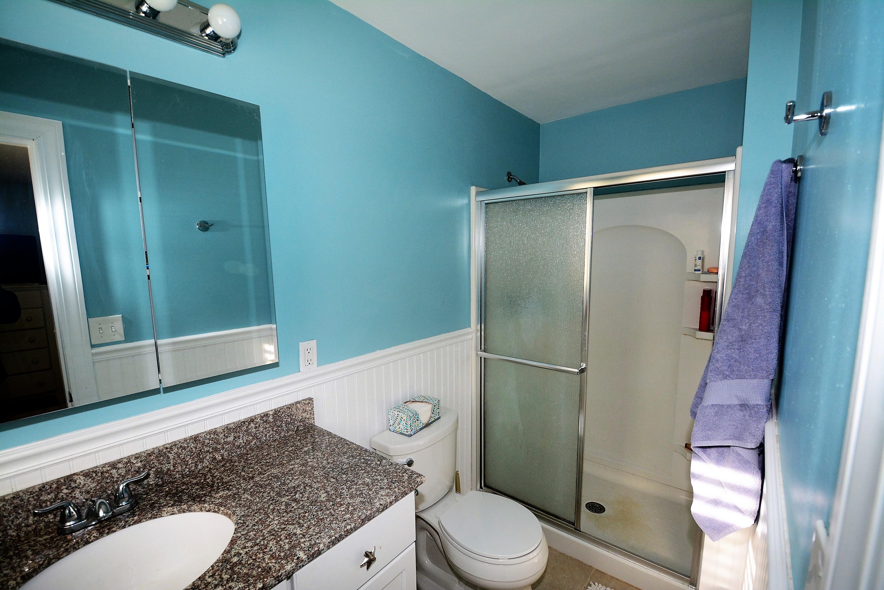 64 Depot Road Cataumet, MA 02534 - Photo 15 of 26 a bathroom with a granite countertop sink toilet and shower