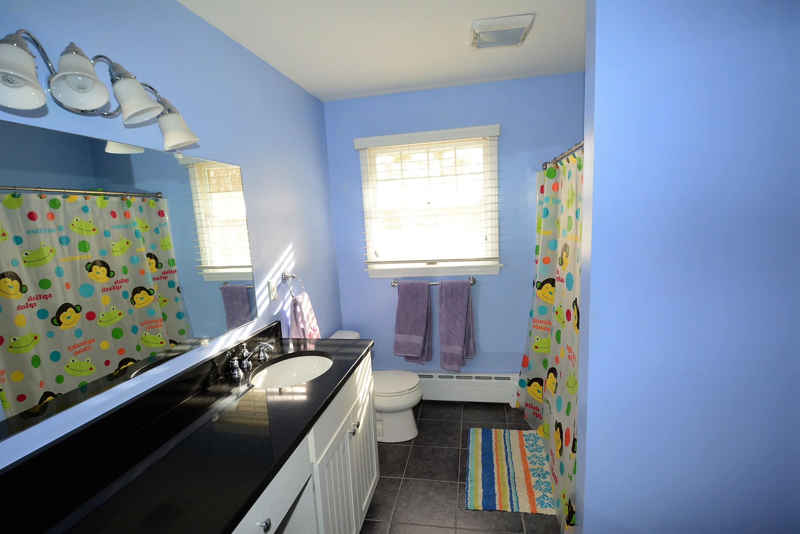 64 Depot Road Cataumet, MA 02534 - Photo 17 of 26 a bathroom with a sink a toilet and a window