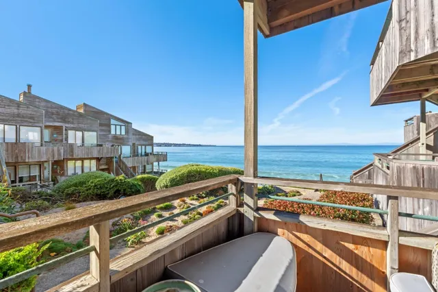a view of a balcony with an ocean view
