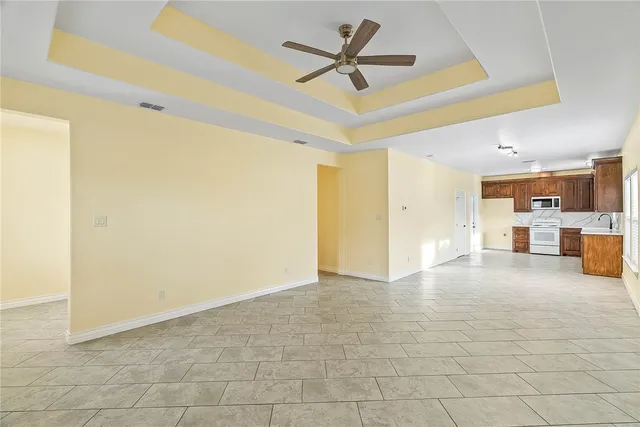 a view of a livingroom with a kitchen