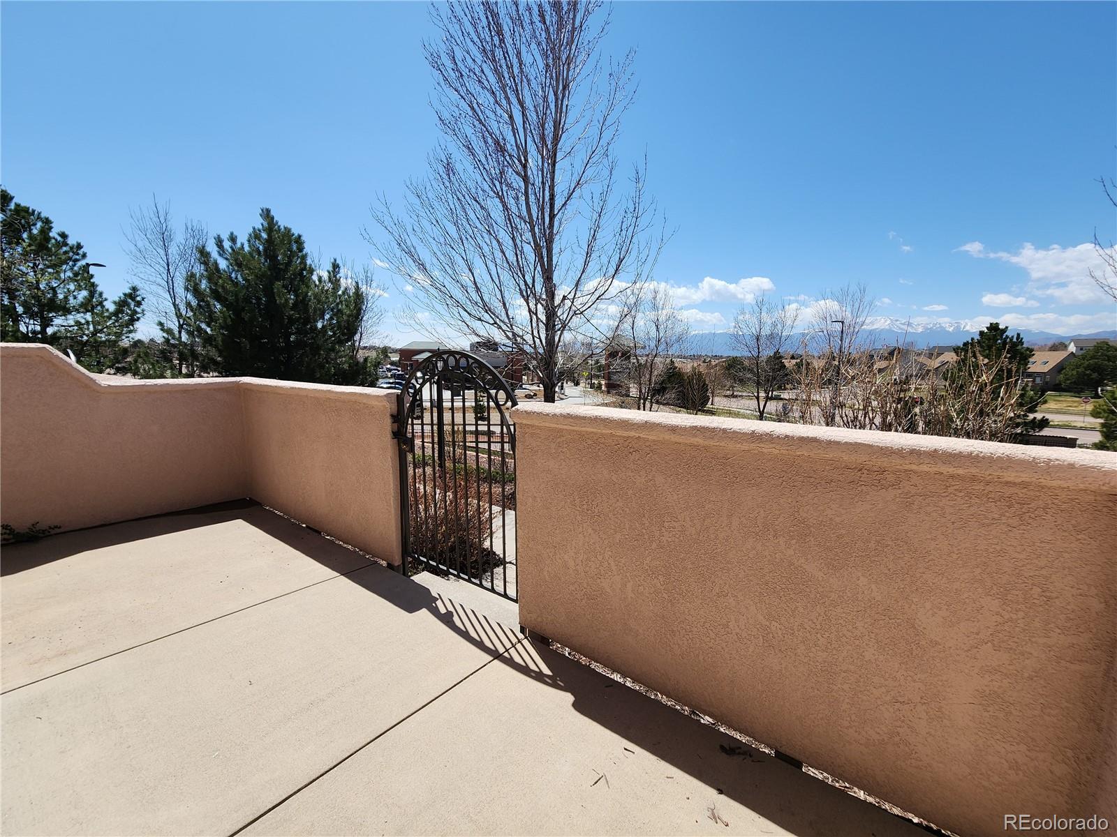 7022 Sand Crest View Colorado Springs, CO 80923 - Photo 3 of 16 a view of city from balcony