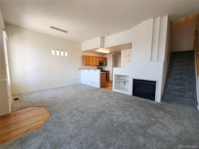 a view of a kitchen with a sink cabinets and a kitchen counter top space