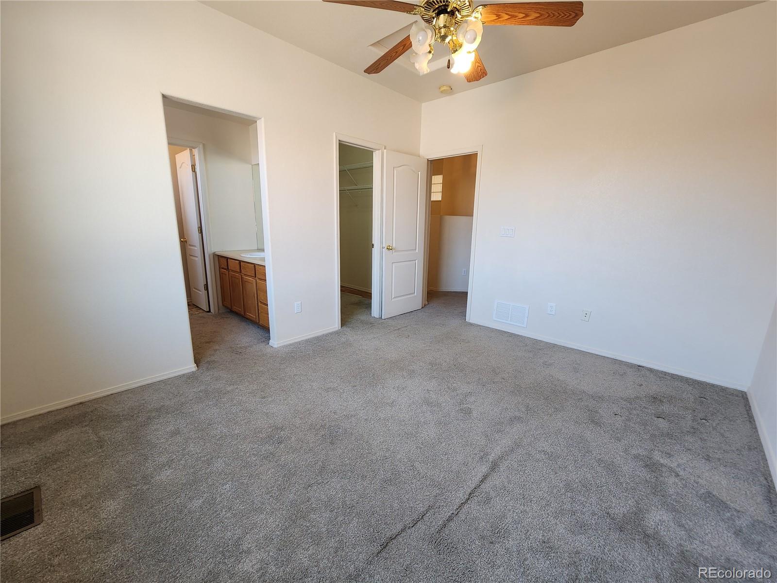 7022 Sand Crest View Colorado Springs, CO 80923 - Photo 9 of 16 an empty room with a bathroom