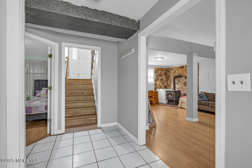 117 Manhattan Street Jackson, NJ 08527 - Photo 25 of 31 a view of a hallway and dining room and fire place