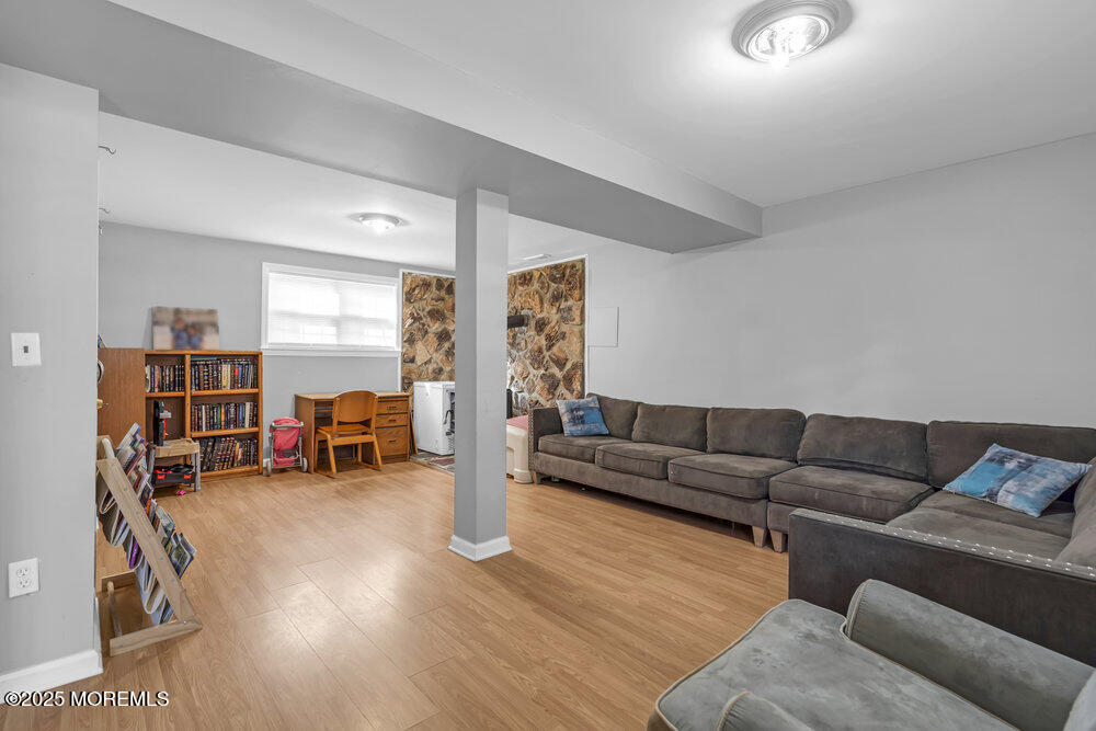 117 Manhattan Street Jackson, NJ 08527 - Photo 26 of 31 a living room with furniture and a large window with rug