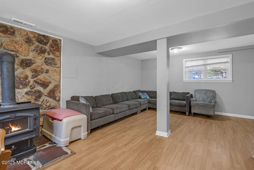 117 Manhattan Street Jackson, NJ 08527 - Photo 27 of 31 a living room with furniture and wooden floor