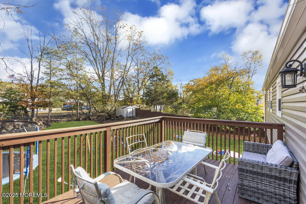 117 Manhattan Street Jackson, NJ 08527 - Photo 29 of 31 a view of a chair and table on the deck