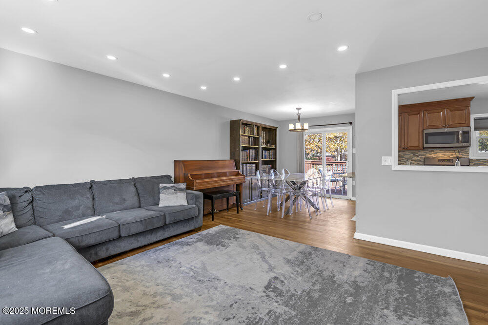 117 Manhattan Street Jackson, NJ 08527 - Photo 7 of 31 a living room with furniture and wooden floor