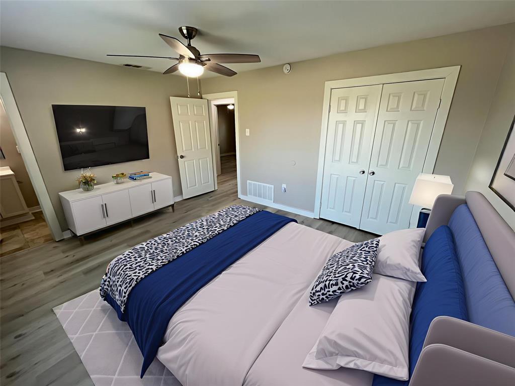 3006 Chiesa Road Rowlett, TX 75088 - Photo 17 of 33 a bedroom with a bed and a flat screen tv