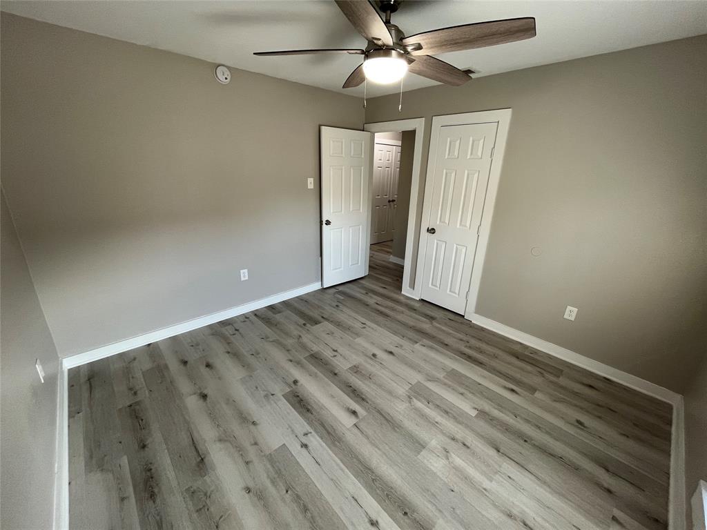 3006 Chiesa Road Rowlett, TX 75088 - Photo 21 of 33 wooden floor in an empty room