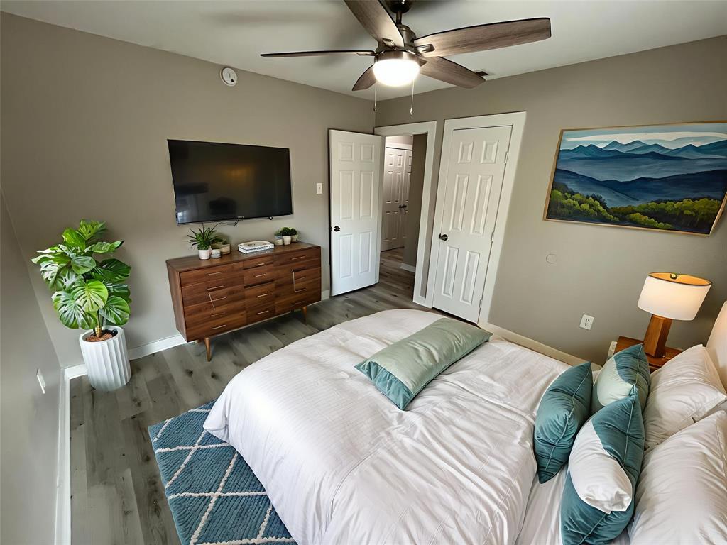 3006 Chiesa Road Rowlett, TX 75088 - Photo 22 of 33 a bedroom with a bed and a flat screen tv