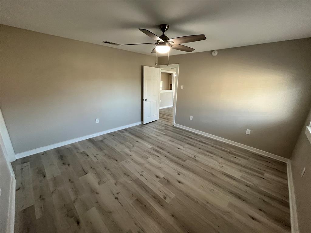 3006 Chiesa Road Rowlett, TX 75088 - Photo 29 of 33 wooden floor in an empty room