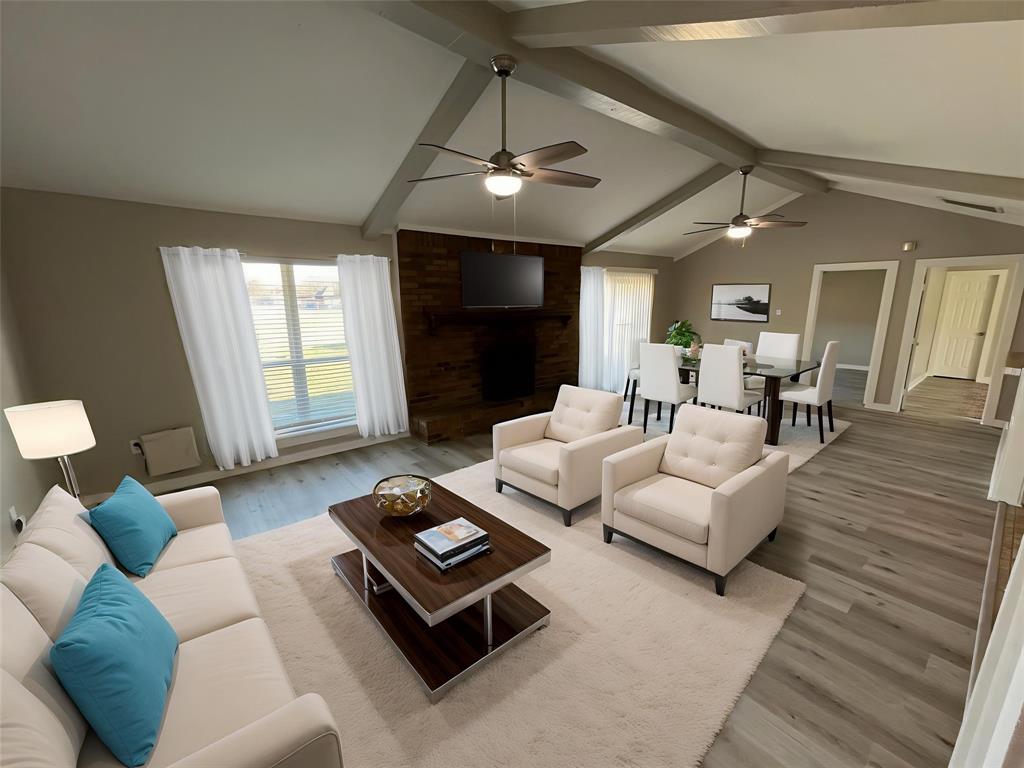 3006 Chiesa Road Rowlett, TX 75088 - Photo 5 of 33 a living room with furniture and a chandelier