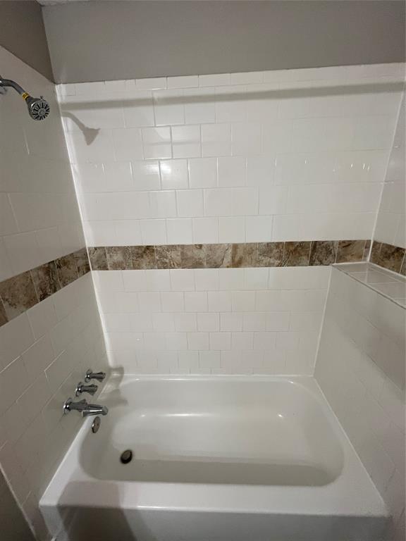 3006 Chiesa Road Rowlett, TX 75088 - Photo 8 of 33 a bathroom with a shower and a bath tub