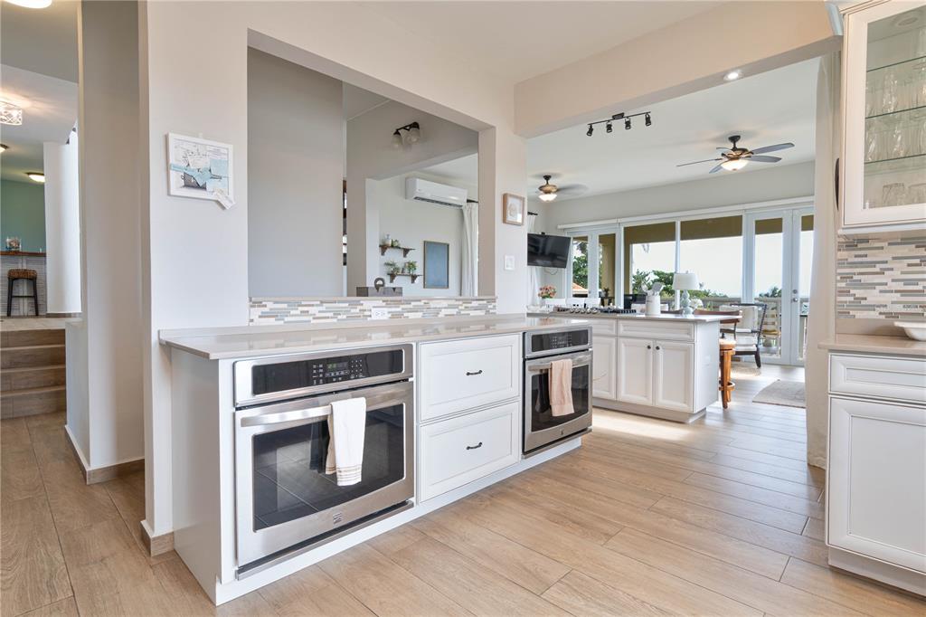 53 Shell Castle Road Humacao, Humacao 00791 - Photo 21 of 22 a kitchen with stainless steel appliances granite countertop a stove and cabinets