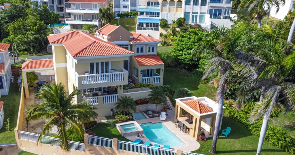 53 Shell Castle Road Humacao, Humacao 00791 - Photo 4 of 22 a aerial view of multiple houses with yard