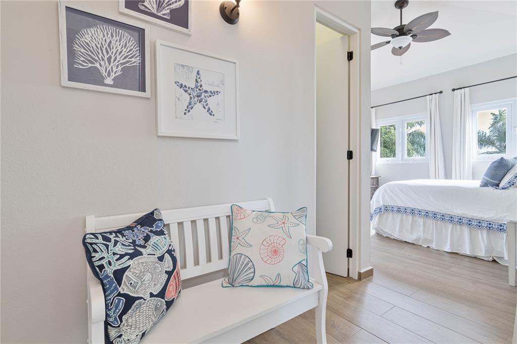 53 Shell Castle Road Humacao, Humacao 00791 - Photo 7 of 22 a bedroom with a bed and wooden floor