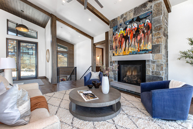 1282 Chimney Rock Road, Unit 344 Heber City, UT 84032 - Photo 6 of 55 Great room featuring a floor-to-ceiling stone fireplace with a substantial hearth, vaulted ceilings with exposed wood beams, and large picture windows