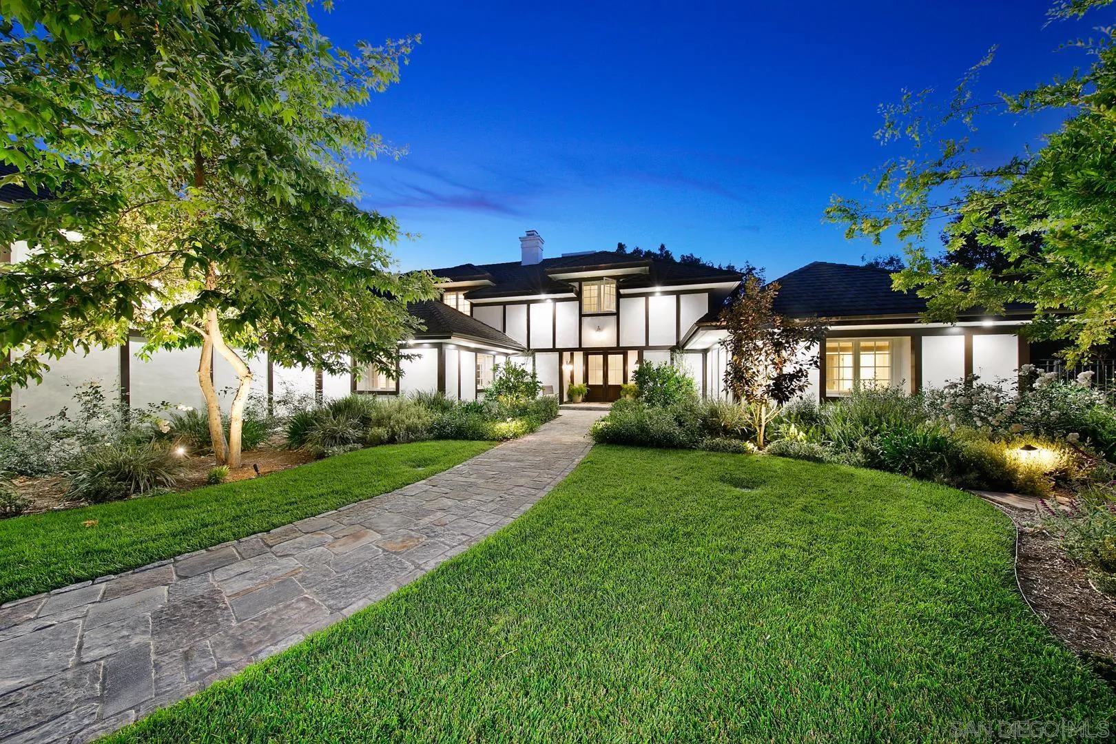 6003 La Flecha Rancho Santa Fe, CA 92067 - Photo 29 of 32 a front view of a house with a yard