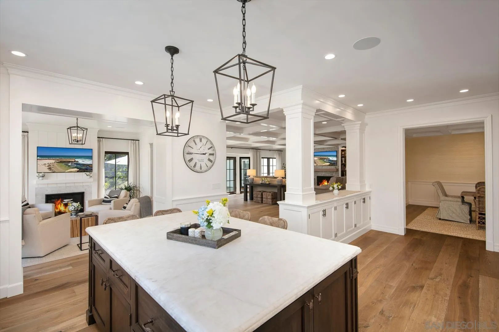 6003 La Flecha Rancho Santa Fe, CA 92067 - Photo 3 of 32 a view of a dining room and livingroom with furniture wooden floor a chandelier