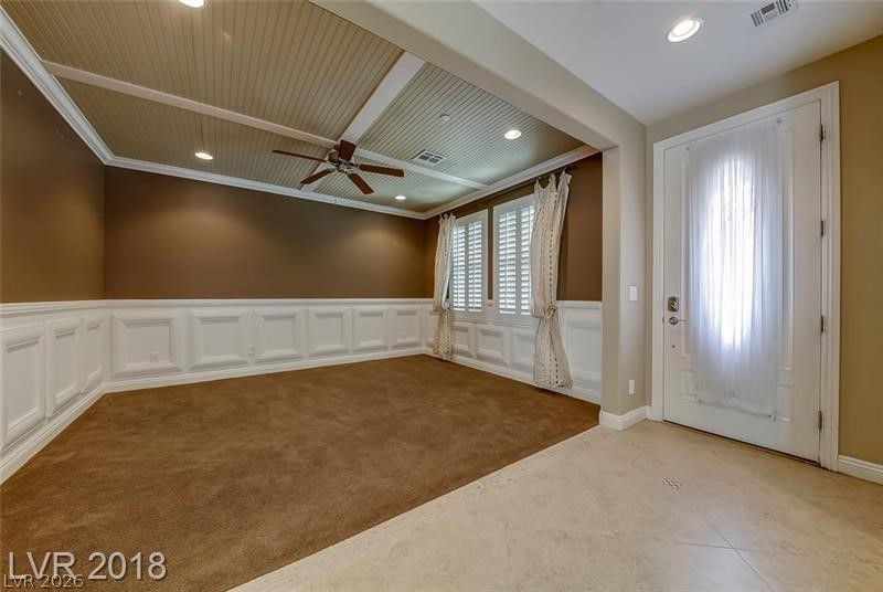 3144 Whitfeild Avenue Henderson, NV 89044 - Photo 4 of 55 A refined entrance area features wainscoting and a distinctive beadboard ceiling.