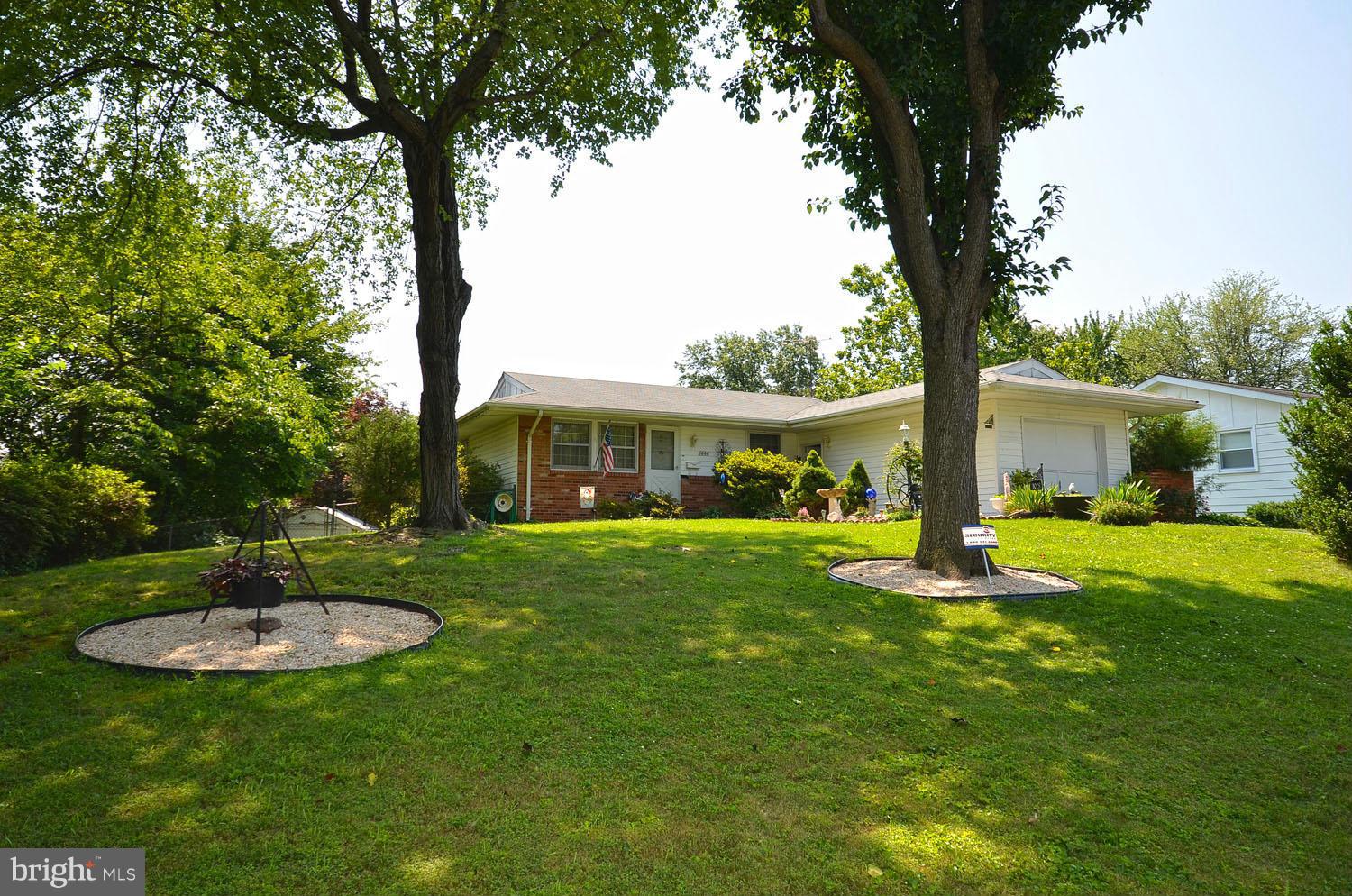 1008 South Hoga Road Sterling, VA 20164 - Photo 1 of 30 a backyard of a house with table and chairs