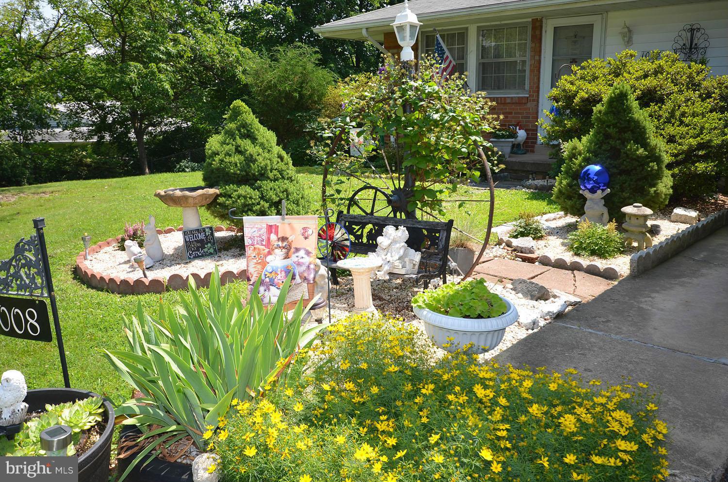 1008 South Hoga Road Sterling, VA 20164 - Photo 3 of 30 a front view of a house with yard and outdoor seating