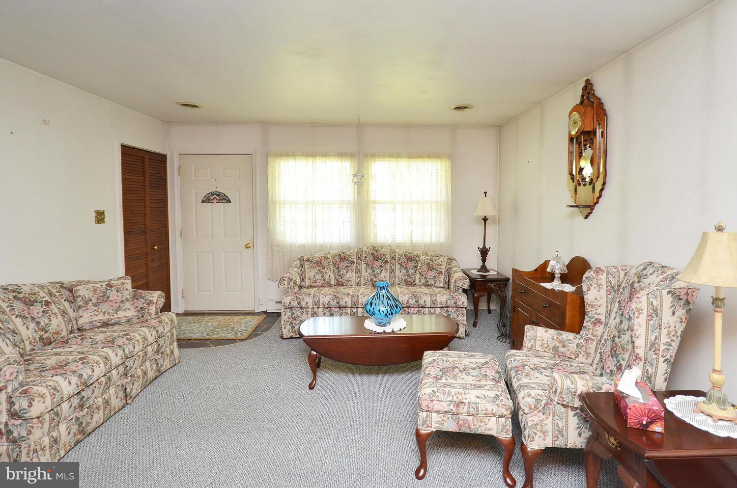 1008 South Hoga Road Sterling, VA 20164 - Photo 4 of 30 a living room with furniture and a large window