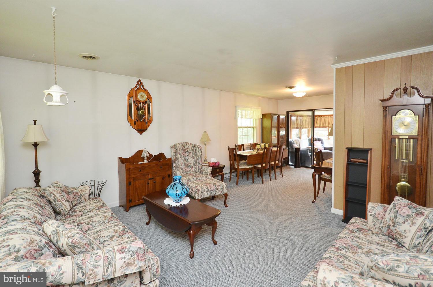1008 South Hoga Road Sterling, VA 20164 - Photo 5 of 30 a living room with furniture and a table