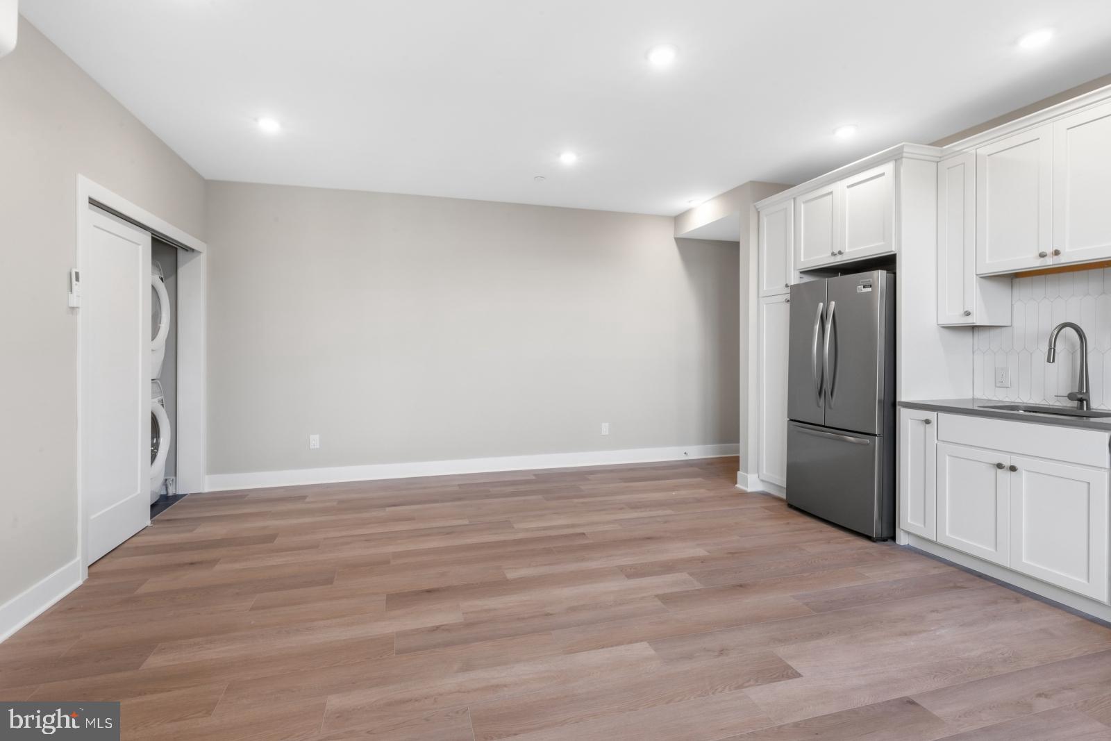 6712 Ridge Avenue, Unit 204 Philadelphia, PA 19128 - Photo 7 of 18 a view of a kitchen with a sink and refrigerator
