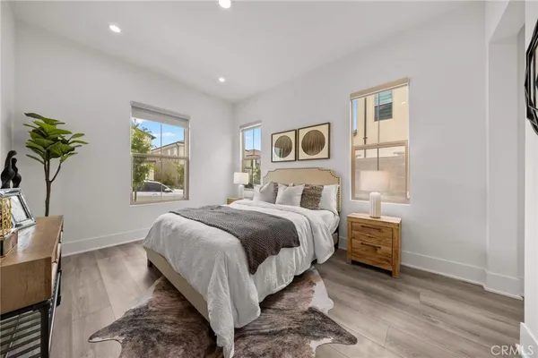 a bedroom with bed and a window