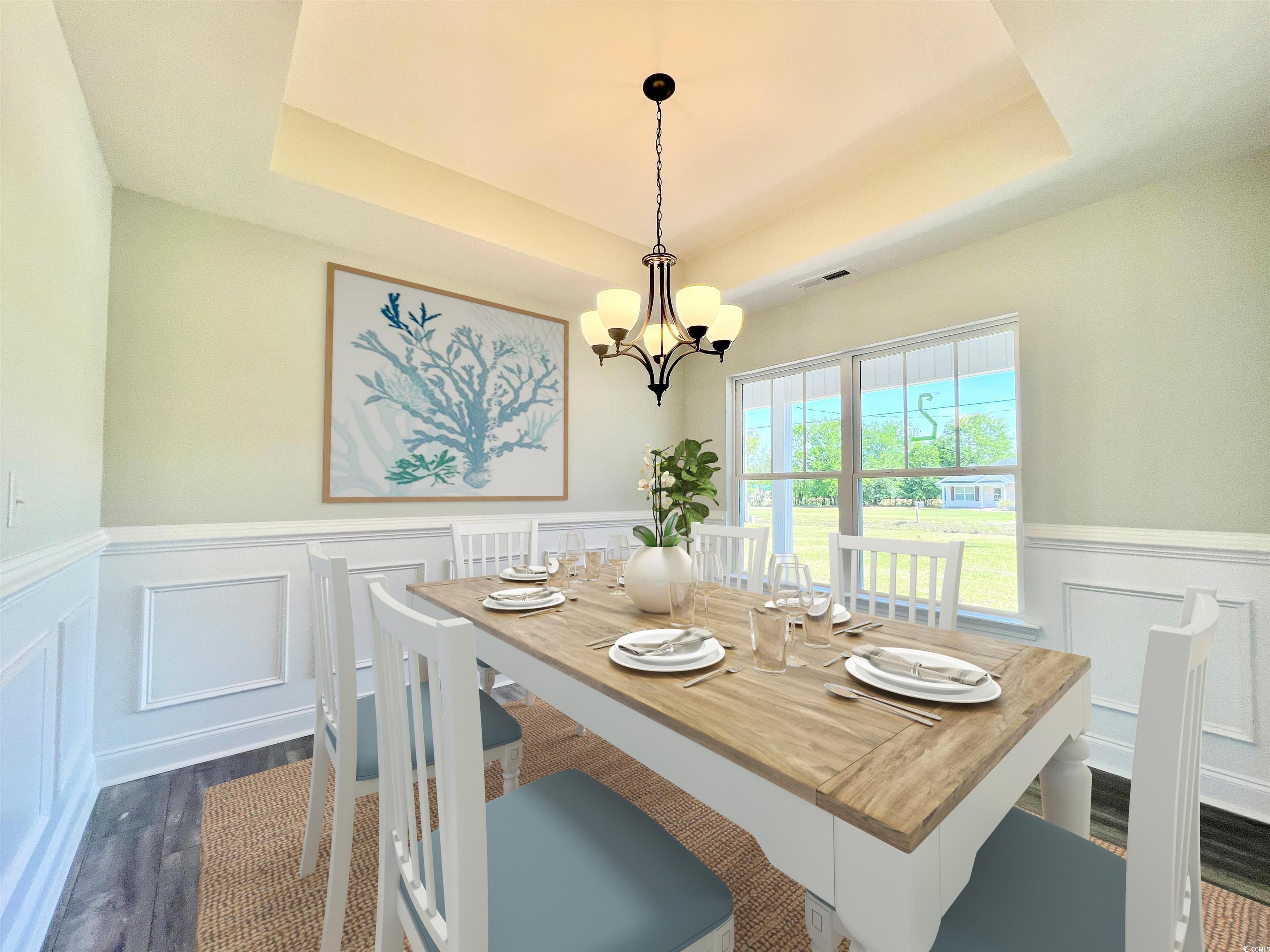 1174 Daisy Road Loris, SC 29569 - Photo 4 of 33 Dining area featuring wood-laminate floors, an inv