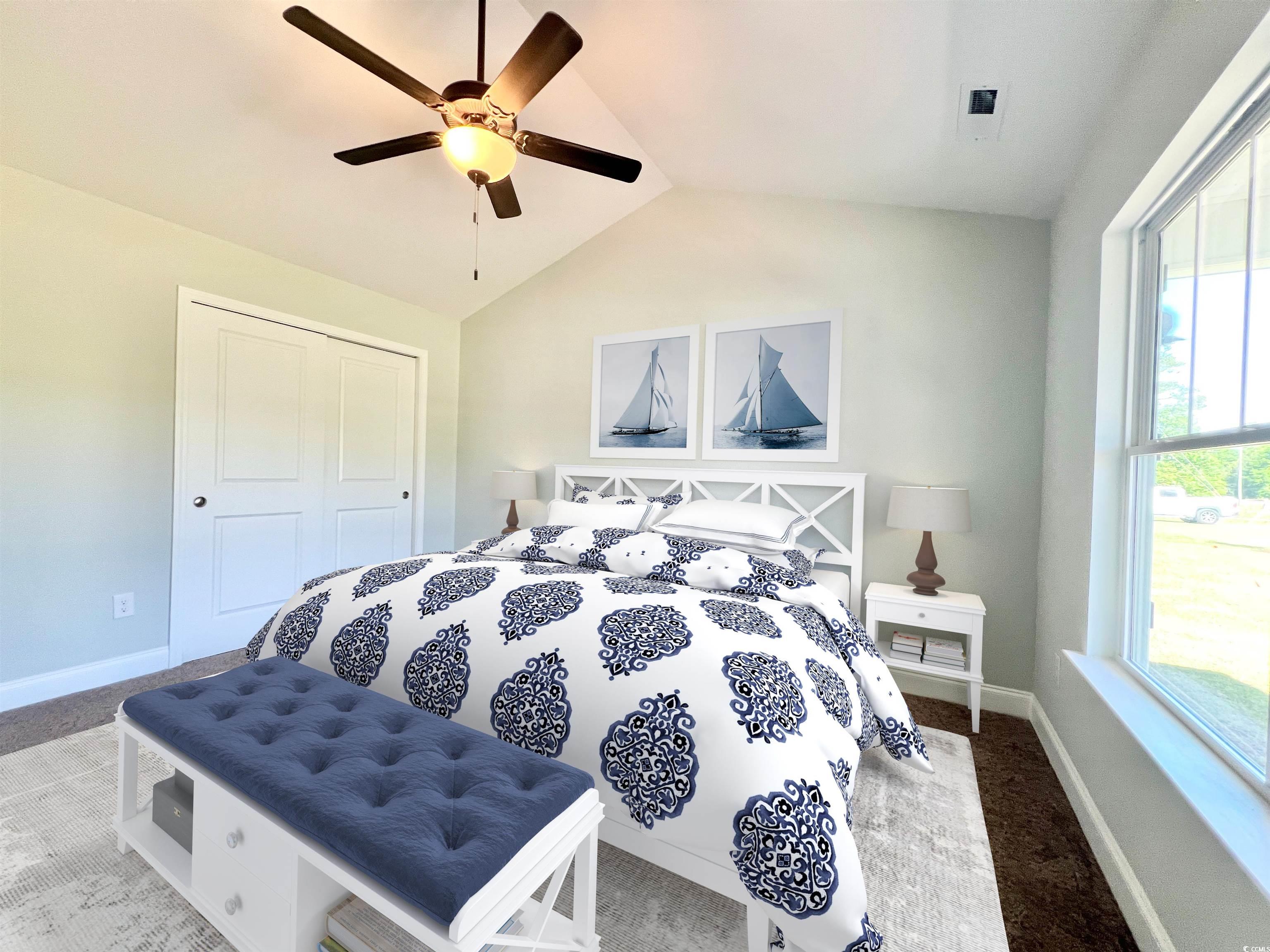 1174 Daisy Road Loris, SC 29569 - Photo 10 of 33 Carpeted bedroom with lofted ceiling, a closet, an