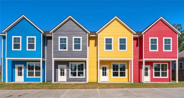 front view of brick house with a yard