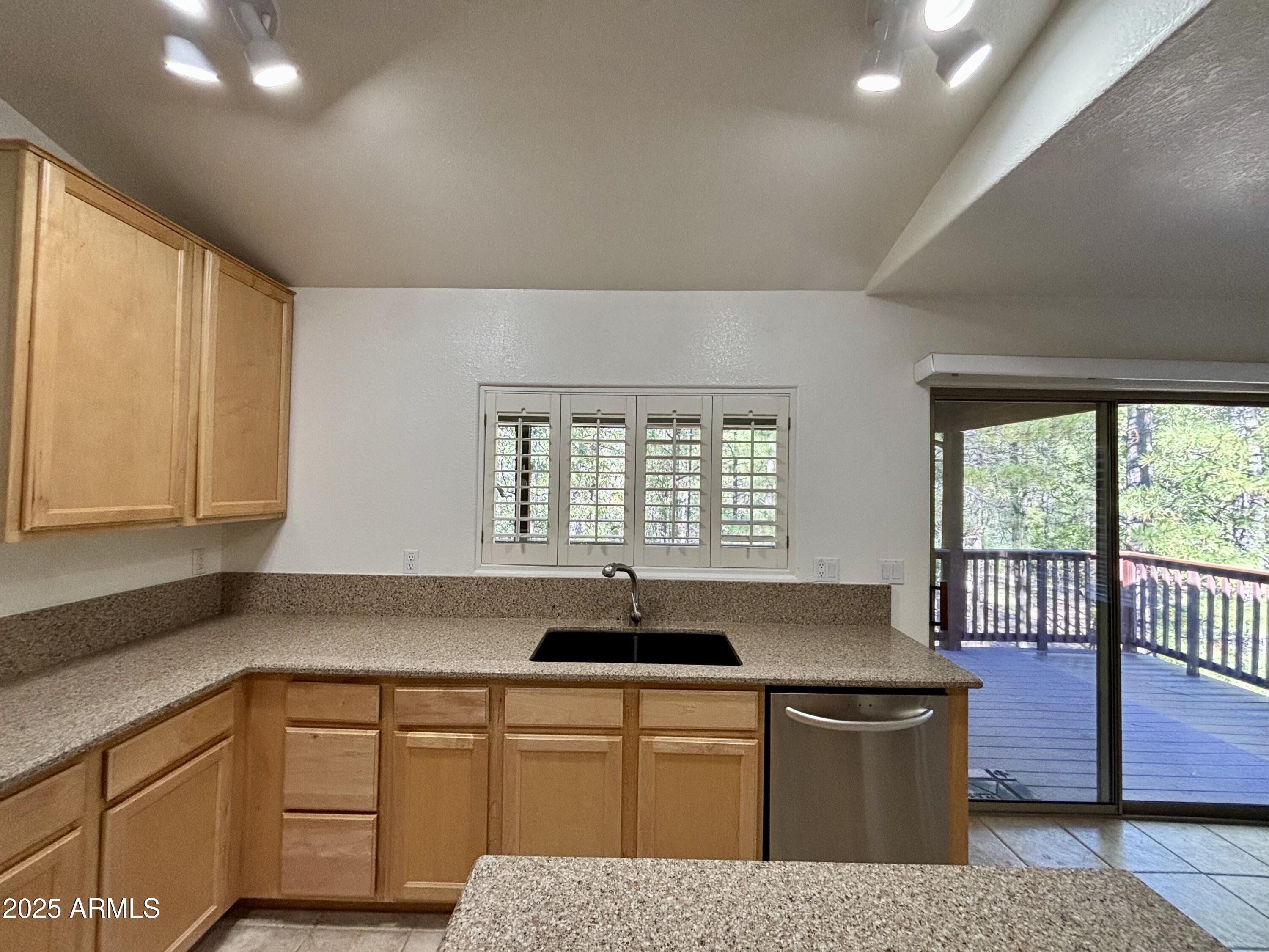 269 Homestead Lane Payson, AZ 85541 - Photo 23 of 38 a kitchen with a sink and cabinets
