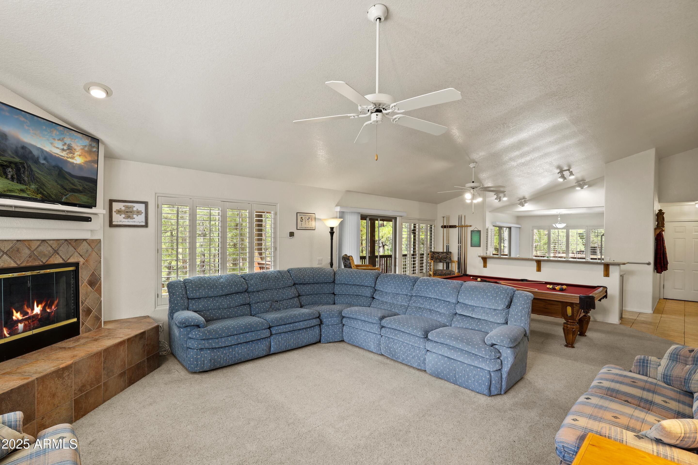 269 Homestead Lane Payson, AZ 85541 - Photo 25 of 38 a living room with fireplace furniture and a fireplace