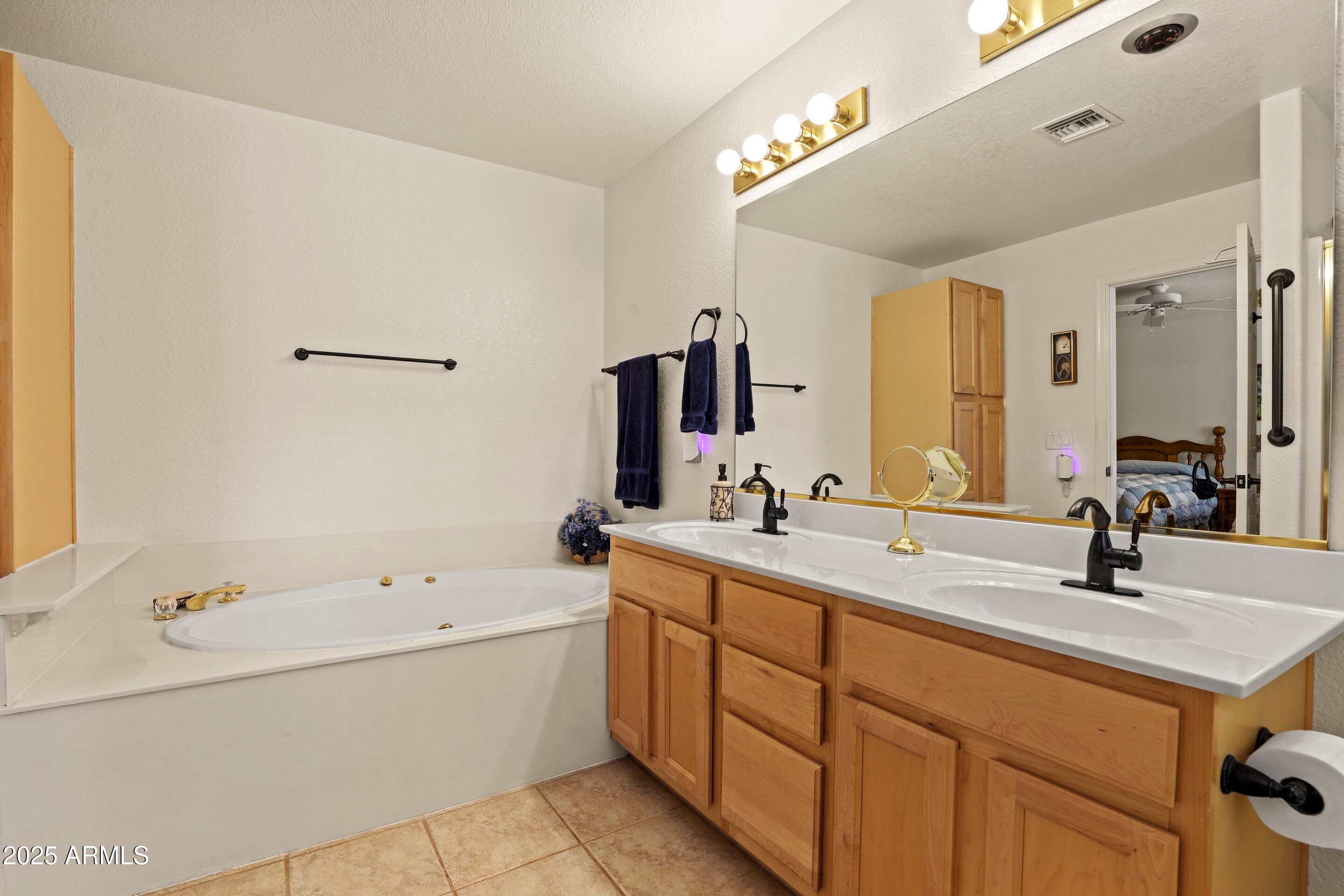 269 Homestead Lane Payson, AZ 85541 - Photo 28 of 38 a bathroom with a double vanity sink mirror and bathtub