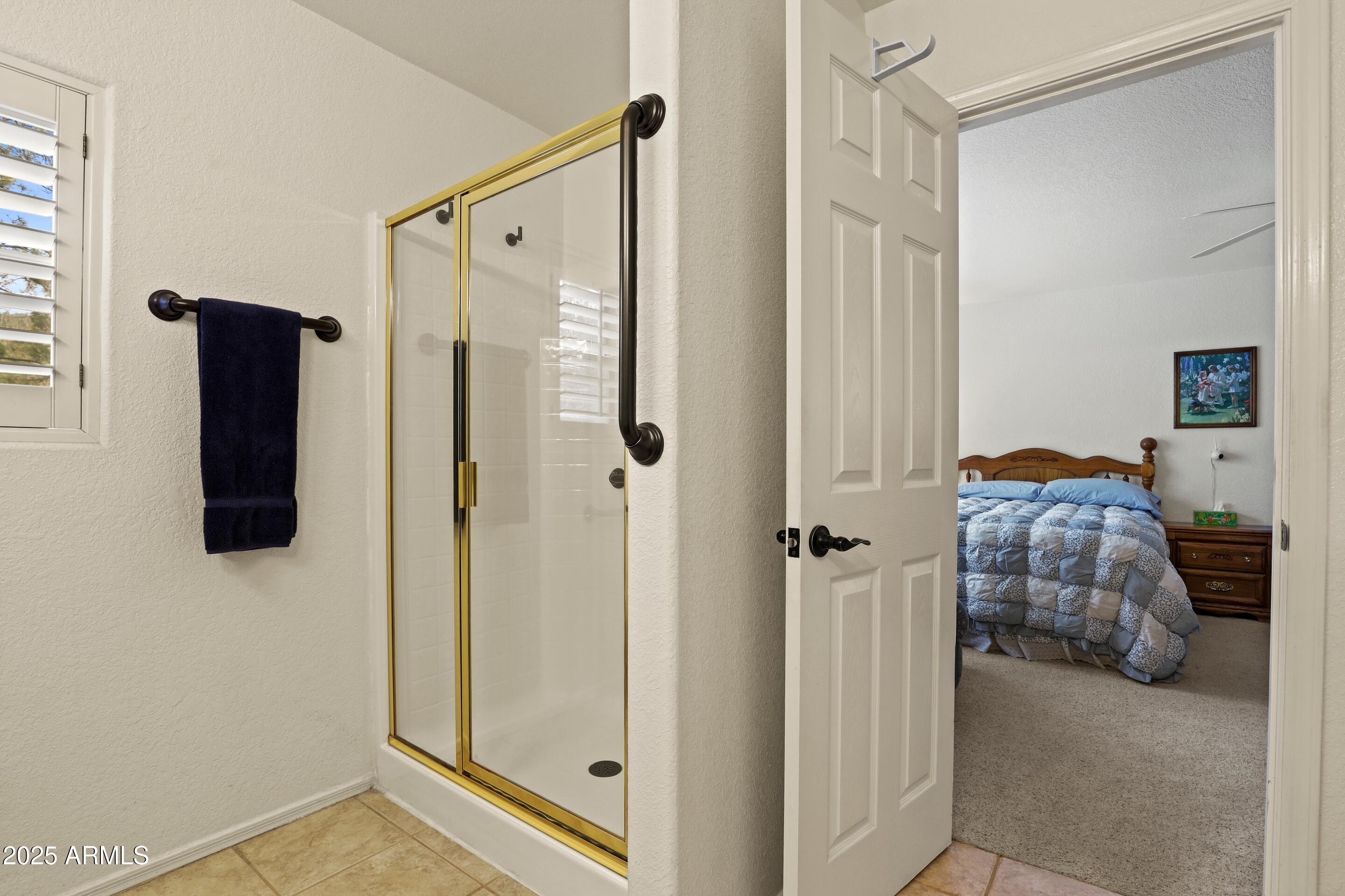 269 Homestead Lane Payson, AZ 85541 - Photo 29 of 38 a bedroom with a bed and a mirror