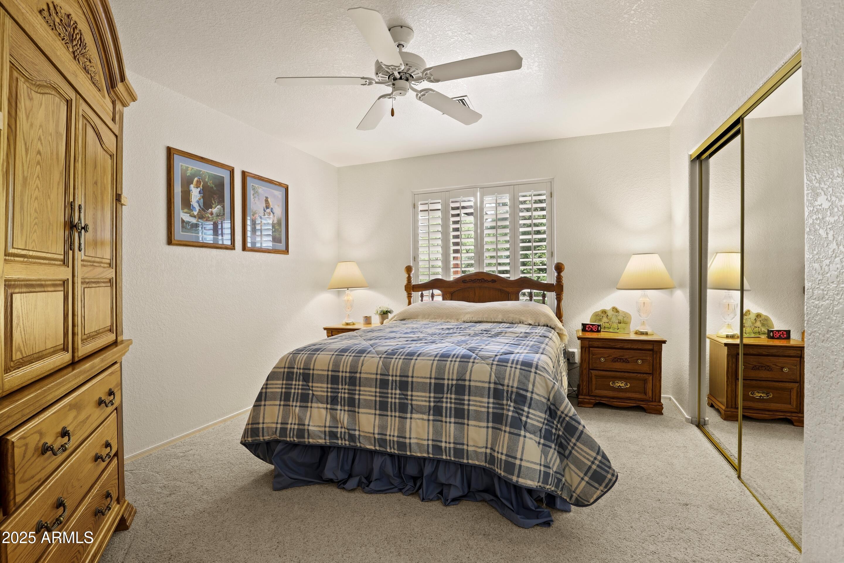 269 Homestead Lane Payson, AZ 85541 - Photo 30 of 38 a bedroom with a bed and dresser with mirror