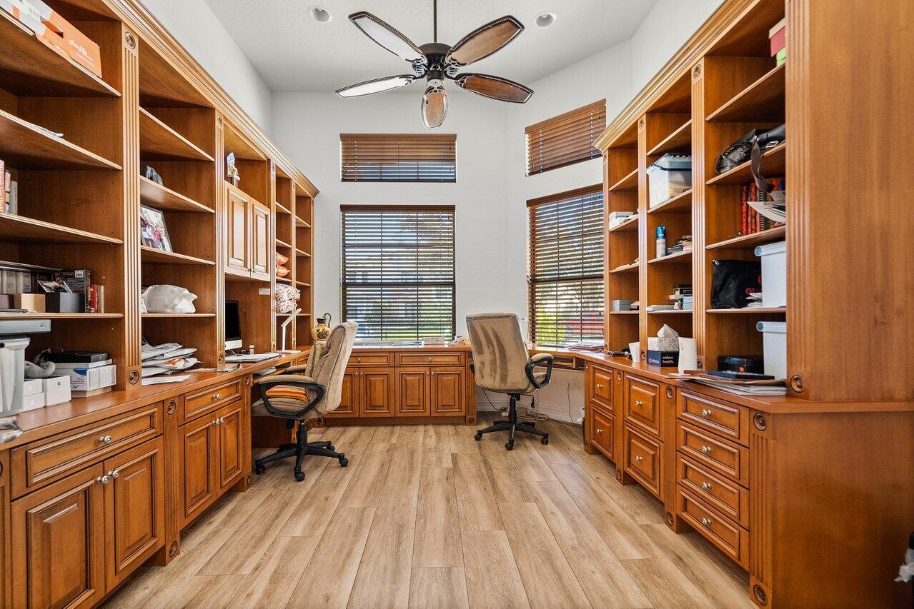 9830 Equus Circle Boynton Beach, FL 33472 - Photo 73 of 90 a view of a workspace with furniture and a bookshelf