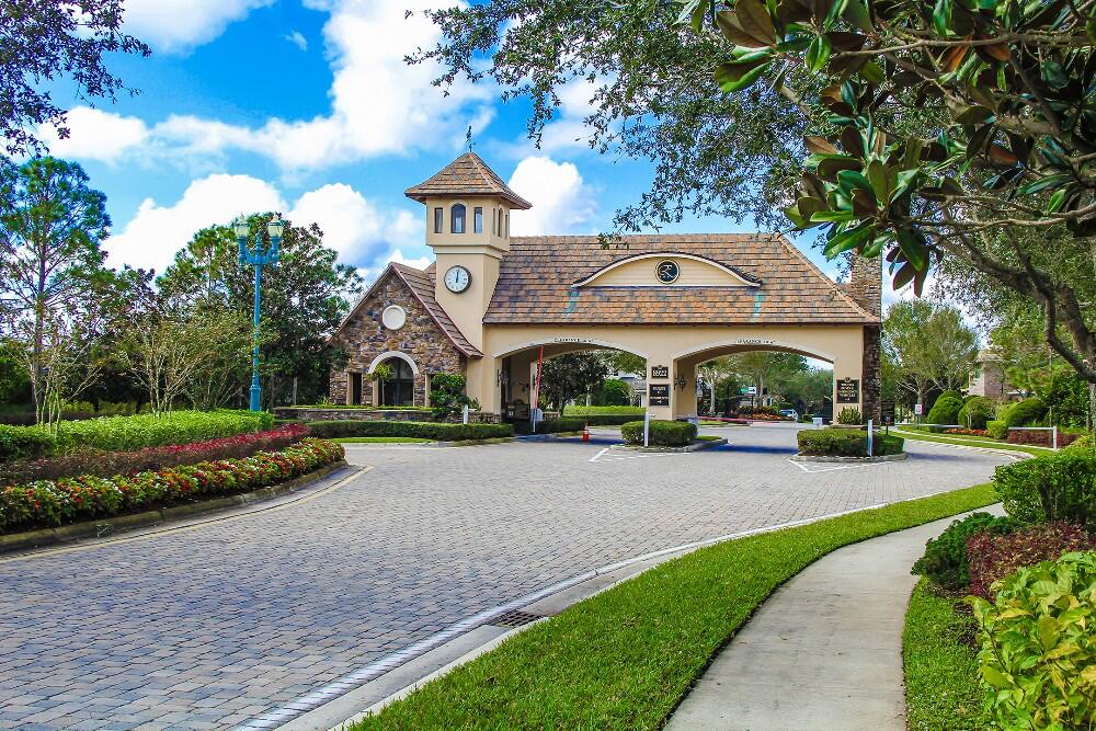 9830 Equus Circle Boynton Beach, FL 33472 - Photo 10 of 90 a front view of a house with a yard and garage