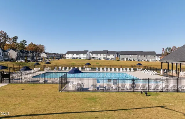 a view of a swimming pool with a patio