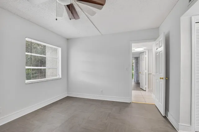 a view of an empty room with a window