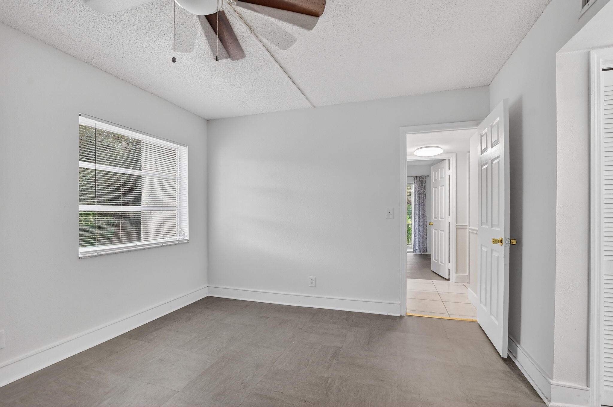 644 Northwest 13th Street, Unit 110 Boca Raton, FL 33486 - Photo 11 of 24 a view of an empty room with a window