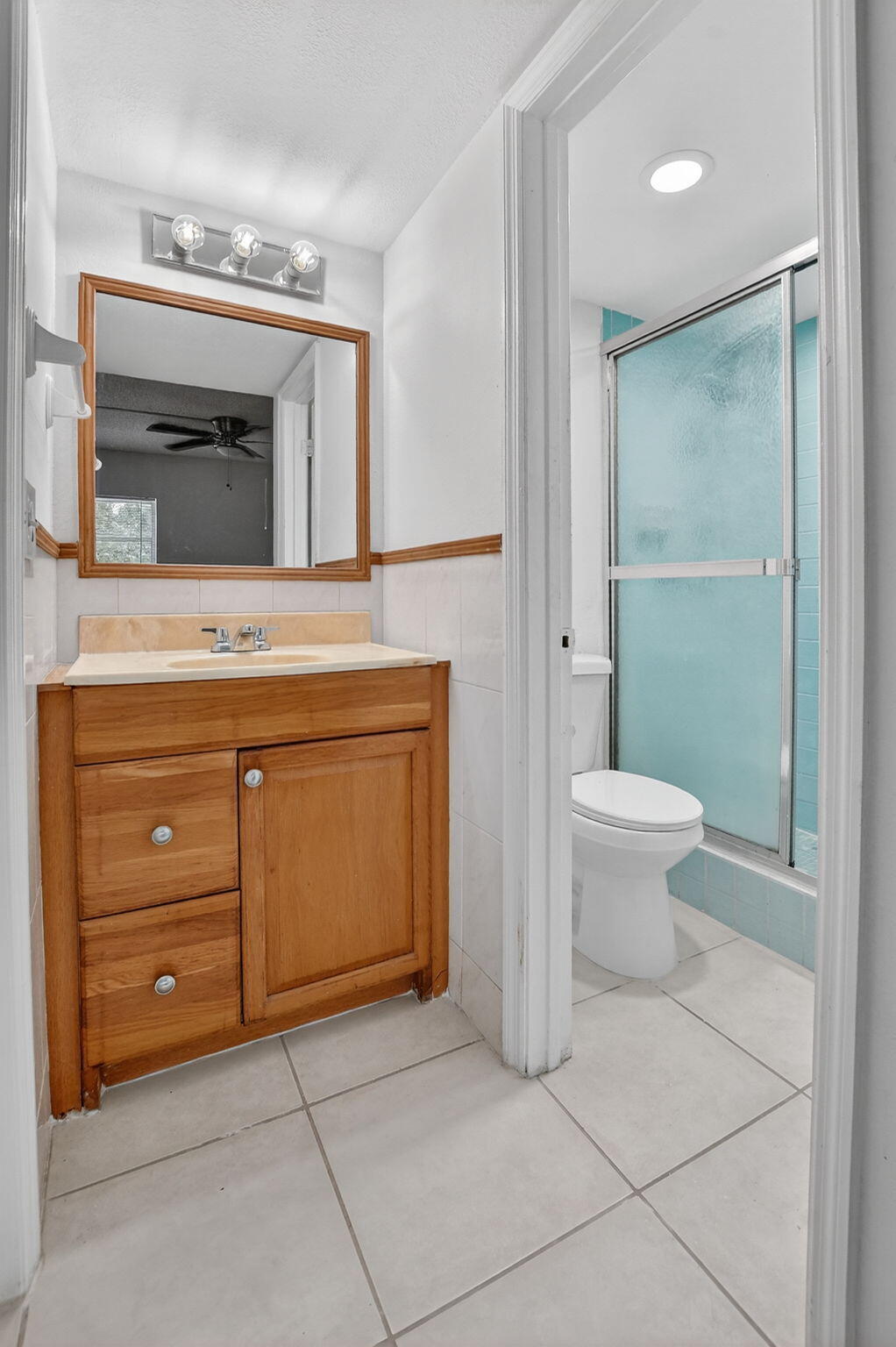 644 Northwest 13th Street, Unit 110 Boca Raton, FL 33486 - Photo 13 of 24 a bathroom with a sink a toilet and mirror